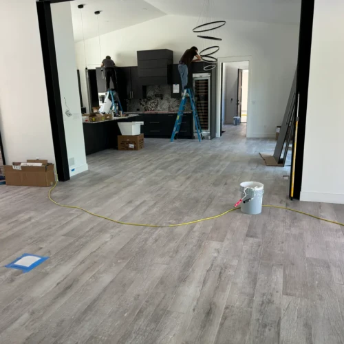 Wide view of an open-concept luxury home in Black Forest, CO, featuring continuous wood-look porcelain tile flooring installation by XCEL TILE.